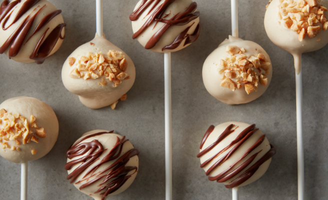 Cake pops drizzled with icing or sprinkled with nuts.